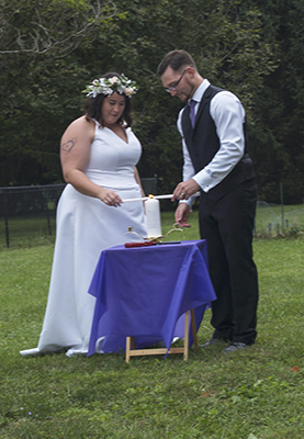 Brittany & Jeffrey light the Unity Candle