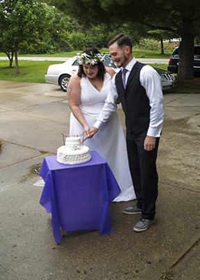 Bride and Groom cutting the wedding cake