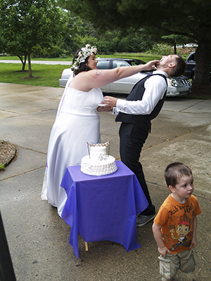 Brittany force feeding Jeffrey the wedding cake
