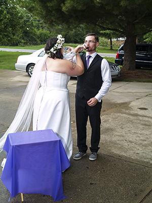 Brittany and Jeffrey drinking their wine toast to each other